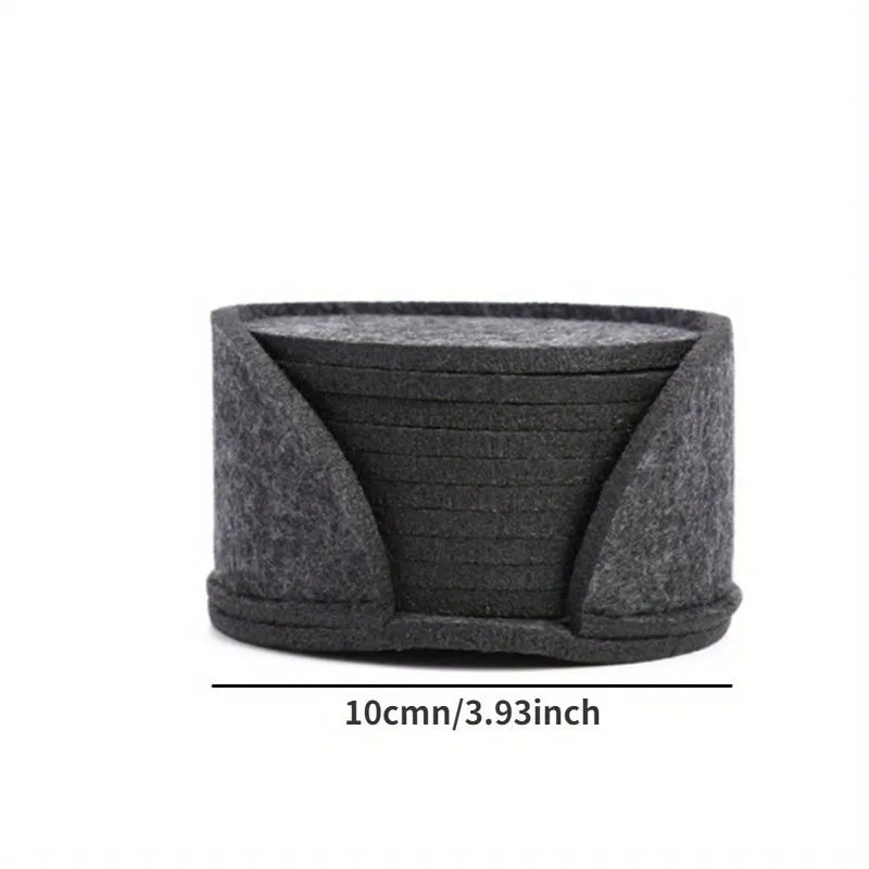 Round felt coaster set of 10 heat resistant drink mats in black, brown, dark gray, and light gray on a wooden table