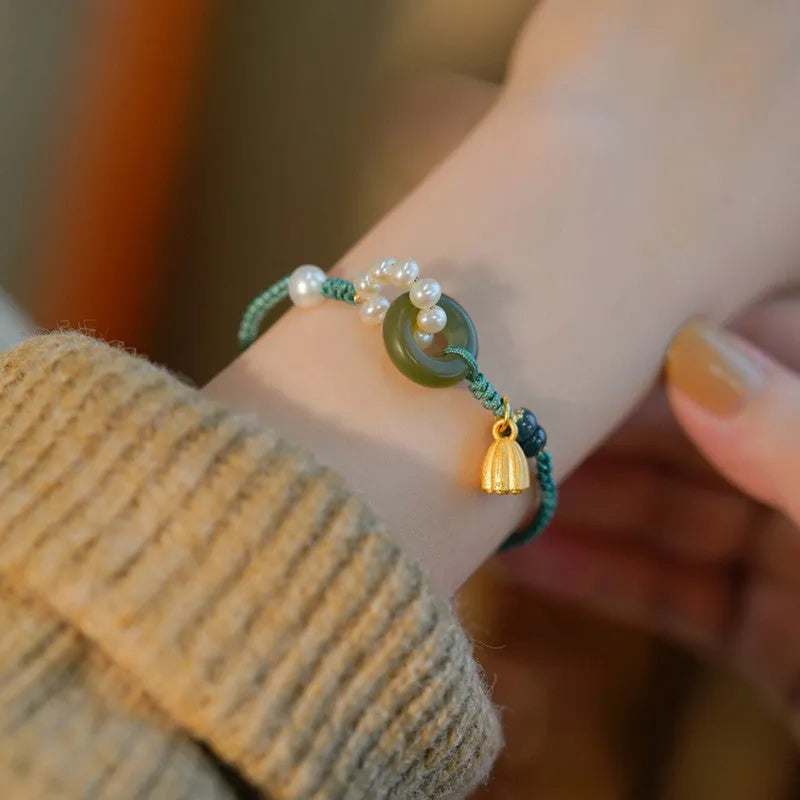 Hand-woven round watch band made from flexible wire with a Pearl Peace Buckle clasp