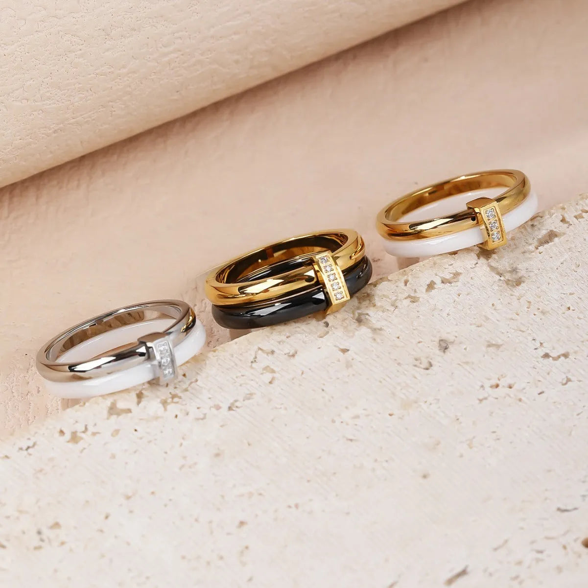Women's titanium steel heart-shaped double ring with glossy stitching and inlaid zirconium stones in three colour options.