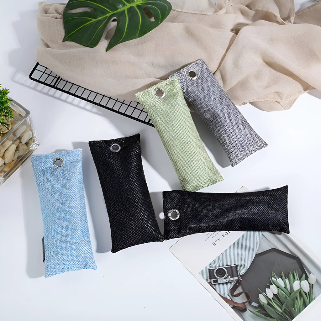 Set of four bamboo charcoal deodorising bags in different colours for shoe and household odour absorption.