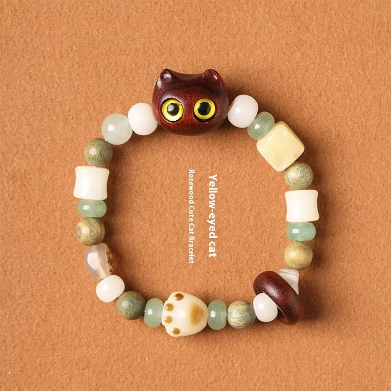 Hand-woven beaded bracelet with jade, bodhi and wood cubes and a wooden Sugar Cat's Paw charm.