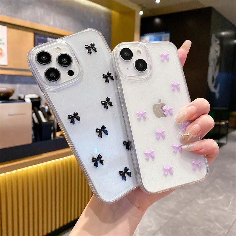 Epoxy glitter bow silicone iPhone case in white, black, purple, or red for iPhone 11 to 16 Pro Max.