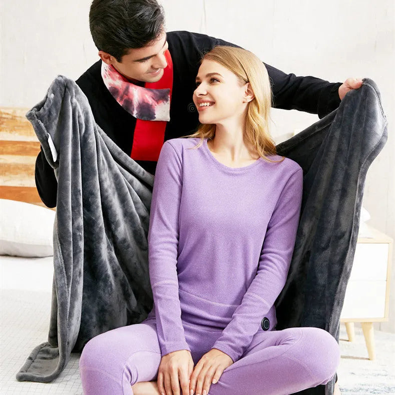 Dark grey USB electric heated plush blanket laid flat, showing controller with single button.