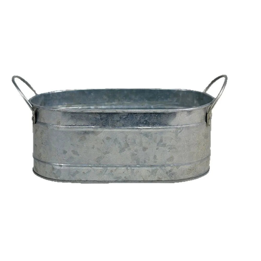 A grey iron sheet succulent flower pot on a wooden desktop.