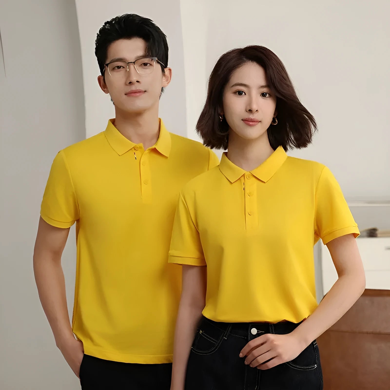 Solid colour short sleeve catering work polo shirt on a hanger, available in multiple colours.