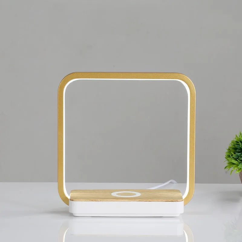 Modern table lamp with wireless charging pad for mobile phone in white finish