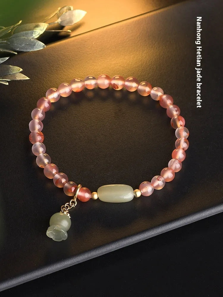 Ice Float Nanhong Agate Bracelet with flower shape and bamboo joint design.