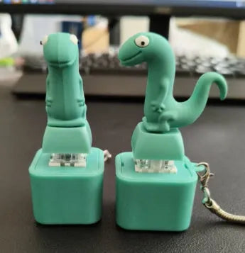 Lizard button keychain decompression clicker in PVC, 3 cm x 6.5 cm, green colour, with rechargeable luminous sounding design