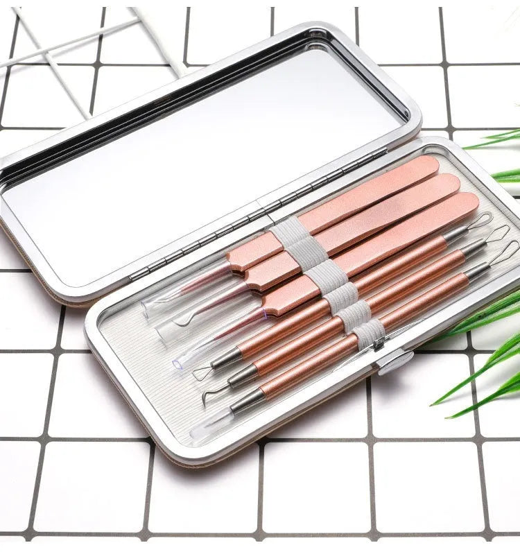 Six-piece stainless steel acne remover tool set in rose gold finish