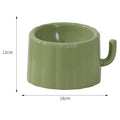 Dark green ceramic cat bowl on a raised cactus-design stand with wide rim and anti-slip base.