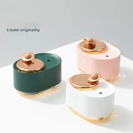 Green rotating planet humidifier with USB cable and 0.5L water tank on wooden desktop