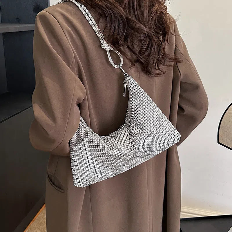 Women's solid-colour nylon shoulder bag with faux rhinestone details, chain strap, and zipper closure in silver