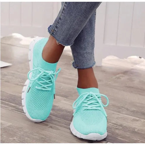Women's high-cut lace-up platform sneakers in multiple colours on a rubber sole.