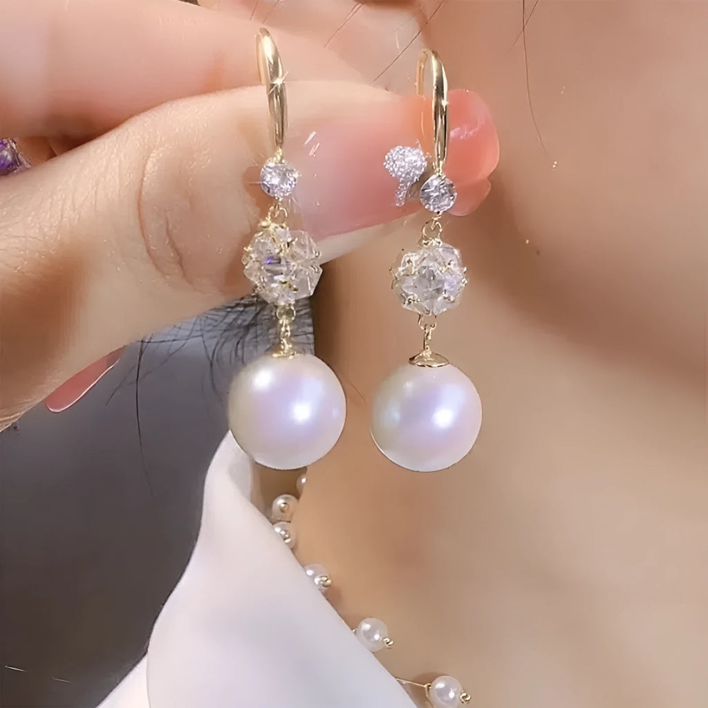 Personalised pearl earrings with red bean accent in a drop style, available in two options.