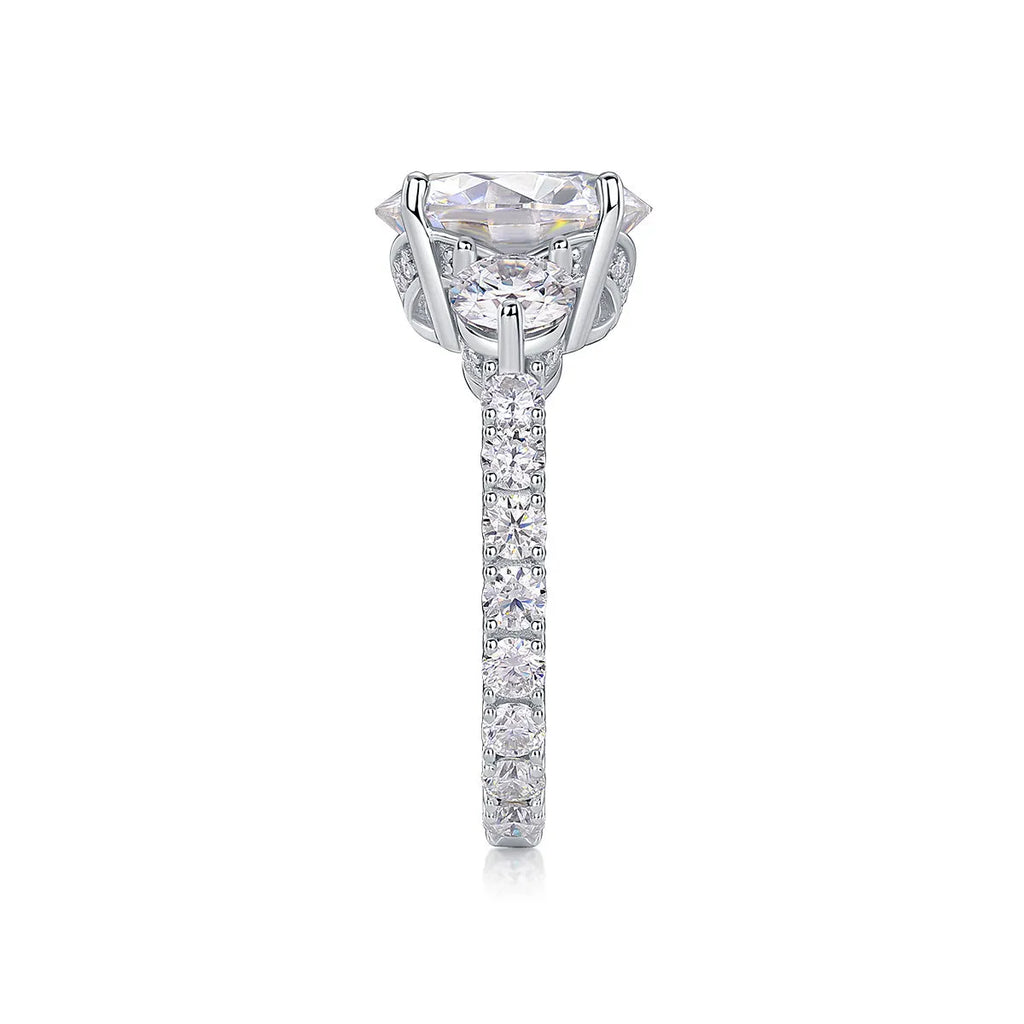 Three-diamond moissanite wedding ring with 5-carat stone, S925 silver band, platinum plating, on a white background
