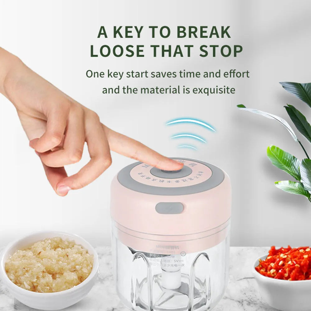 Mini electric garlic chopper with stainless steel blade and USB charging cable in green colour