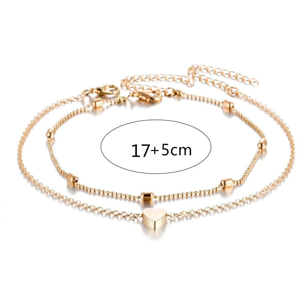 Double-layered heart-shaped anklet with retro beach-inspired chain in gold and silver colors