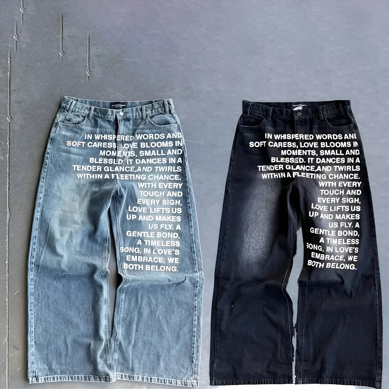 Men's loose-fit wide-leg straight trousers in black cotton fabric, laid flat to show the casual cut.