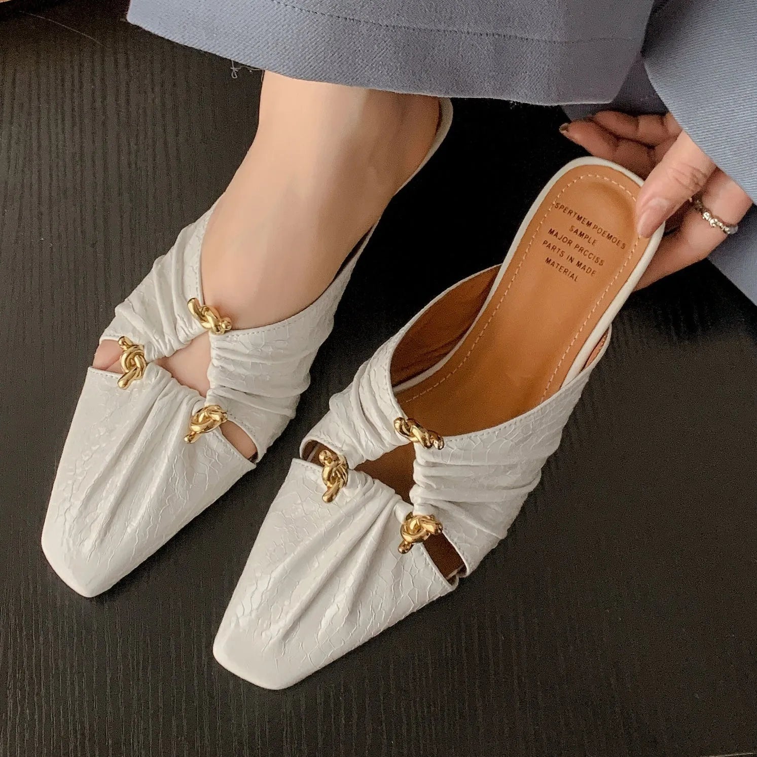 Genuine leather women's square toe slippers in beige, low heel, shown from side.