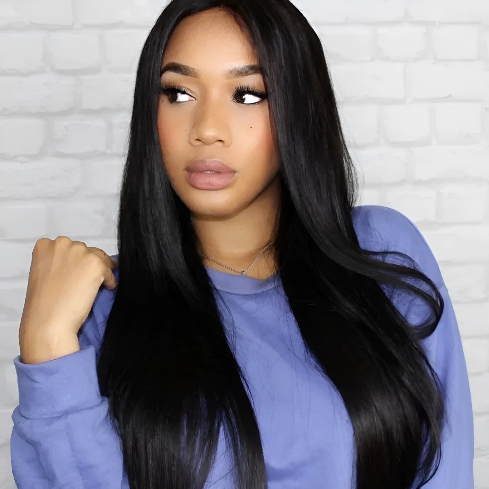 Long straight black wig with centre-parted bangs, synthetic high-temperature fibre construction.