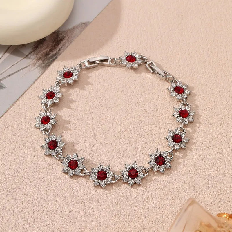 Luxury style bracelet with coloured gems and floral design on zinc alloy with electroplated finish