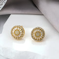 Round geometric copper earrings with electroplated gold finish and pattern design