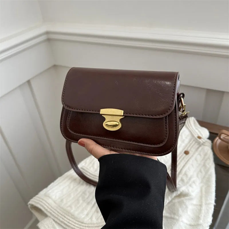 Retro small square handbag in soft brown PU leather with horizontal orientation