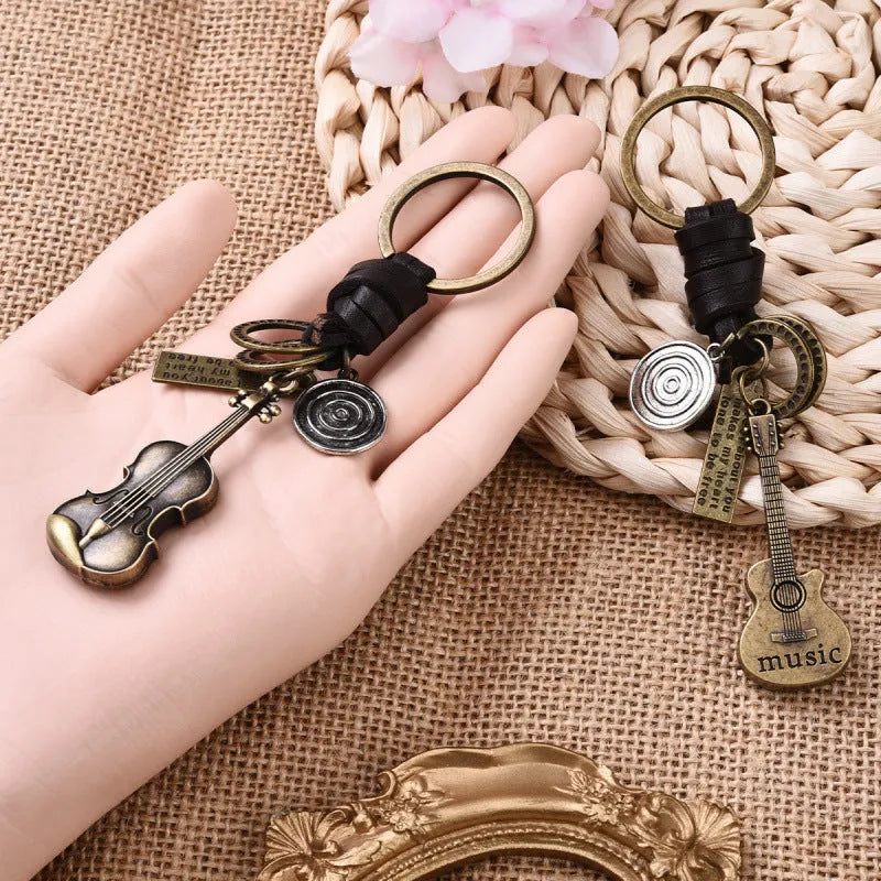 Alloy guitar keychain pendant with cowhide woven charm in retro design
