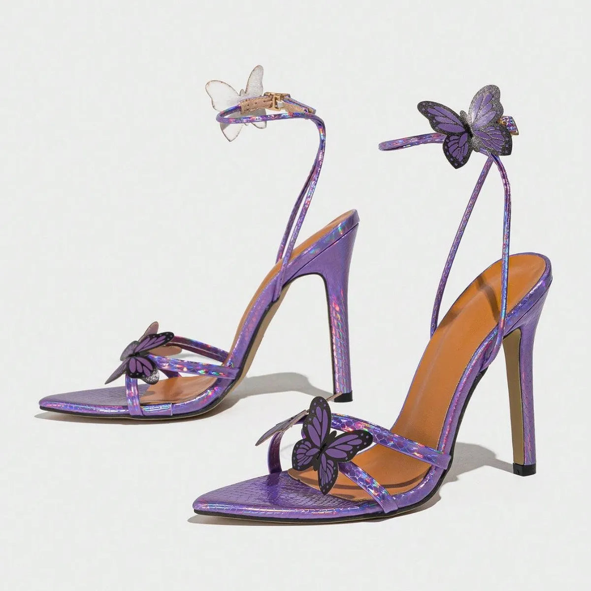 Women's purple pointed-toe sandals with three-dimensional butterfly decoration on toe bracket and stiletto heel over 8 cm.