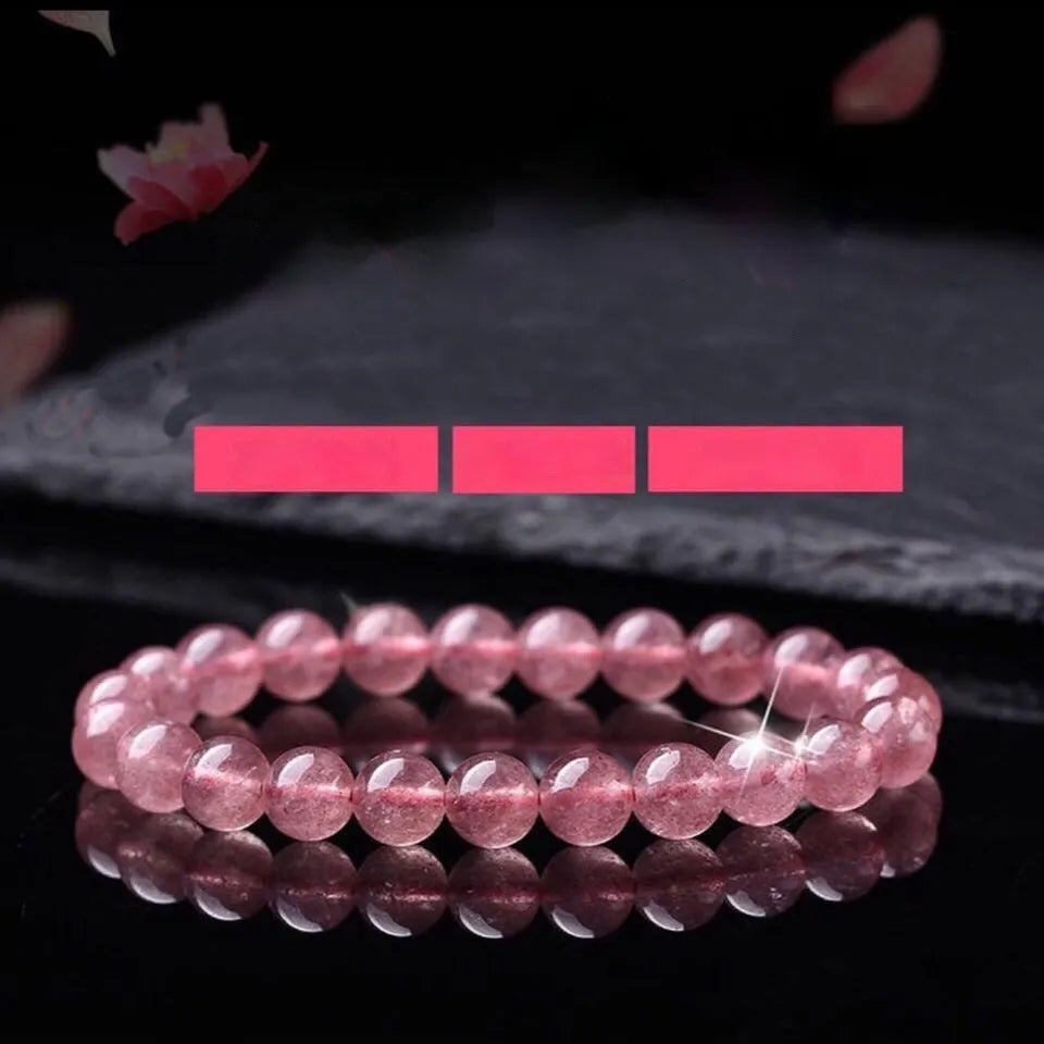 Women's strawberry quartz crystal bracelet with polished beads on an elastic cord, shown in 6mm, 8mm, and 10mm sizes.