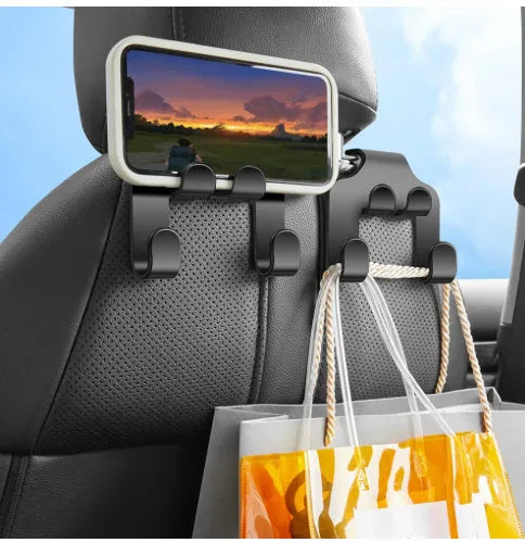 Two white ABS car-mounted multifunction hooks showing phone bracket and hanging hook uses.