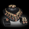 Women's alloy jewellery set with rhinestone pendant, earrings, and bracelet in 18K gold colour