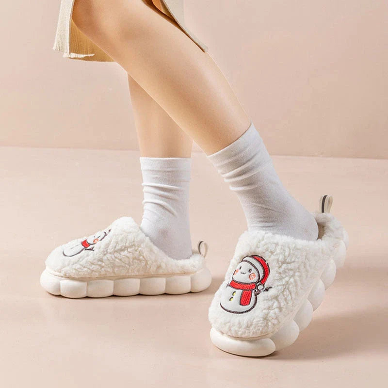 Cozy snowman-designed slippers with plush upper and anti-slip sole for indoor winter wear