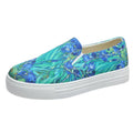 Women's low-top canvas slip-on shoes in colour matching pattern with rubber sole.