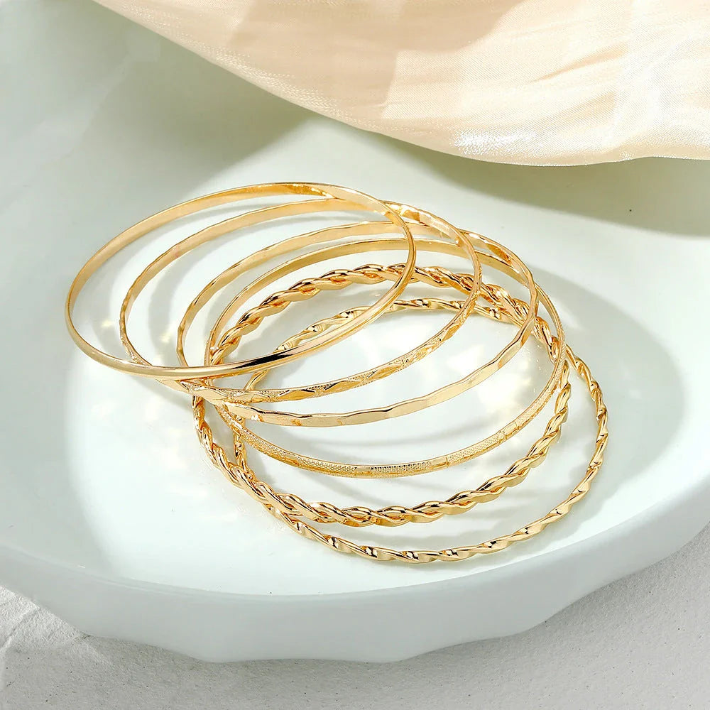 Stylish Bohemian chain bracelets in a gold tone color with geometric shapes, perfect for fashion-forward women