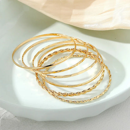 Stylish Bohemian chain bracelets in a gold tone color with geometric shapes, perfect for fashion-forward women