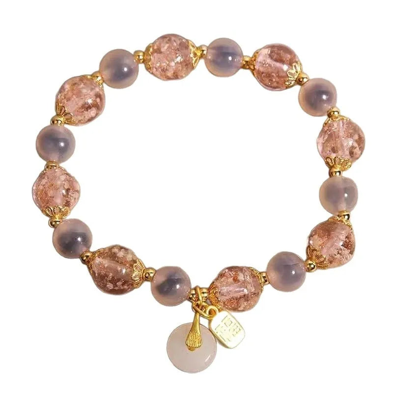 Women's pink heart agate bracelet with peace buckle closure and luminous glaze details