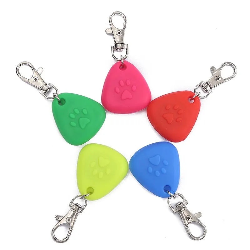 Silicone triangle light-up pendant pet ornament in red, pink, blue, green, or yellow colours.