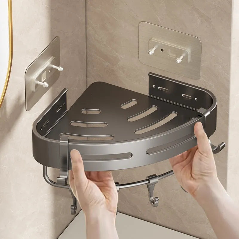 Gun grey wall-mounted corner bathroom storage rack with a single shelf, shown in a shower.