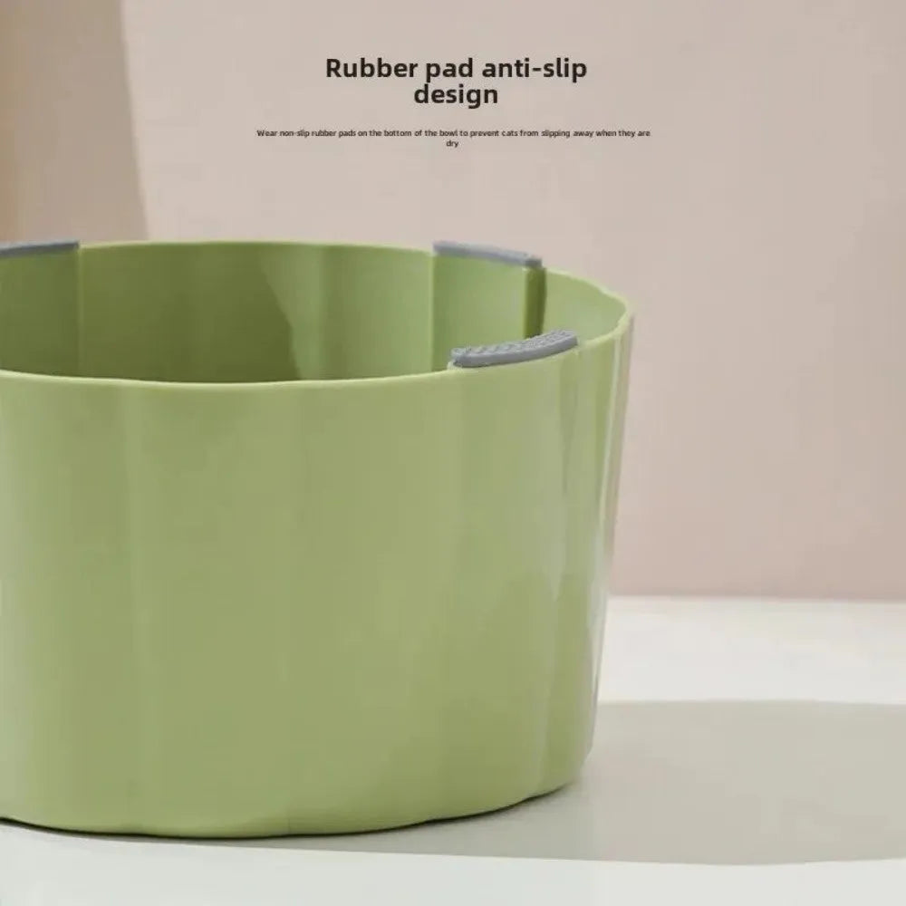 Dark green ceramic cat bowl on a raised cactus-design stand with wide rim and anti-slip base.
