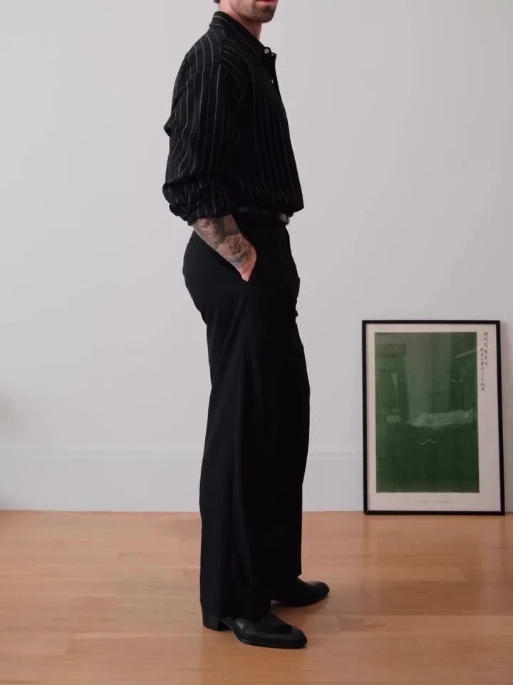 Men's black pinstriped button-down polyester shirt with long sleeves and a regular fit.