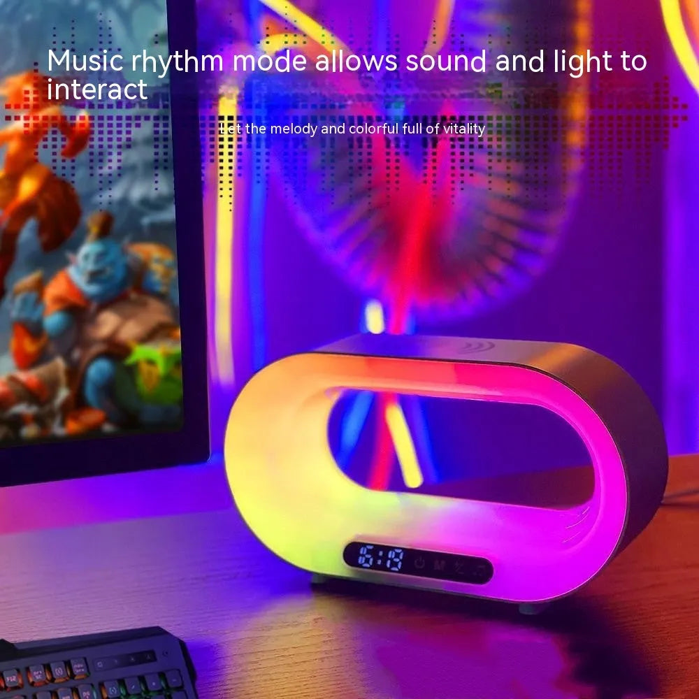 White multifunctional 3-in-1 LED night light with app control, RGB atmosphere lamp, wireless charger, and alarm clock on a desk
