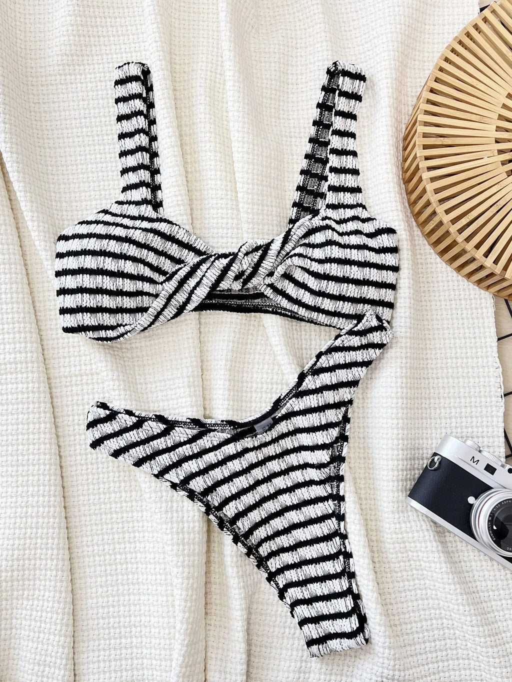 Women's black and white contrast colour bikini set with polyester fabric, slim brief cut, and bra and shorts