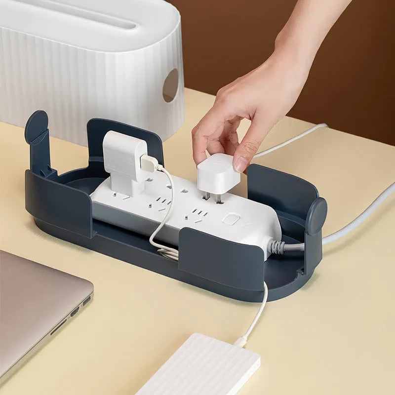 Blue and white HIPS plastic power strip storage box with lid open, showing phone slot and cable holes.