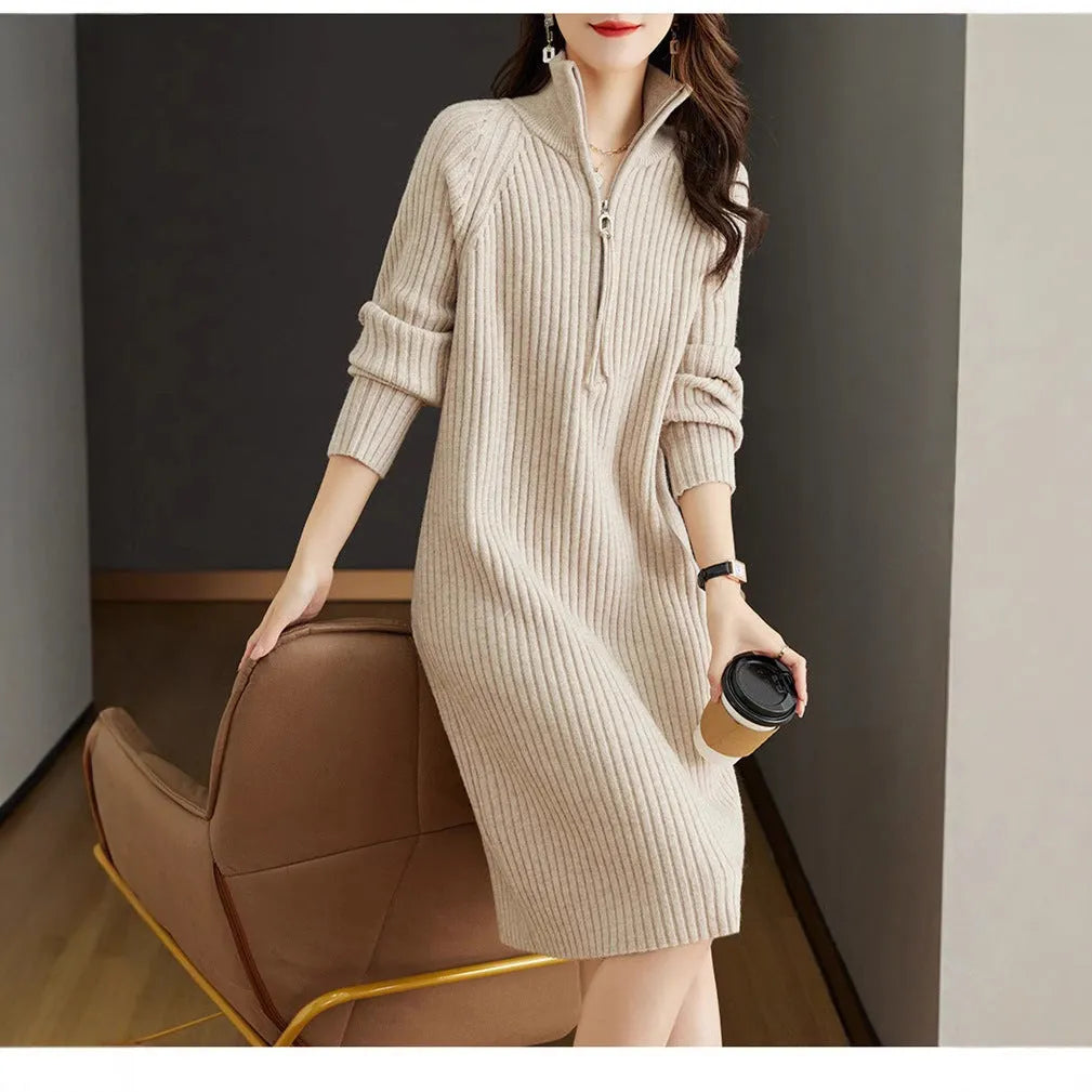 Beige casual skirt with half front zipper, stand collar, and long sleeves on a mannequin.