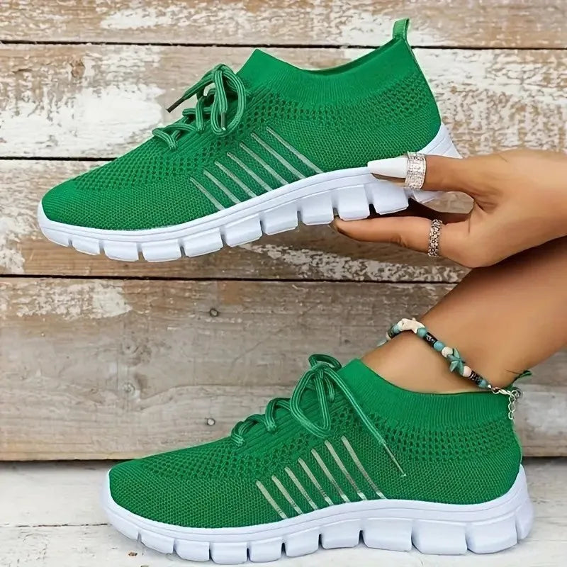 Women's high-cut lace-up platform sneakers in multiple colours on a rubber sole.