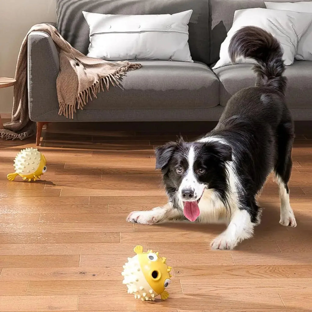 Yellow durable vinyl fish-shaped dog chew toy with squeaker for aggressive chewers.