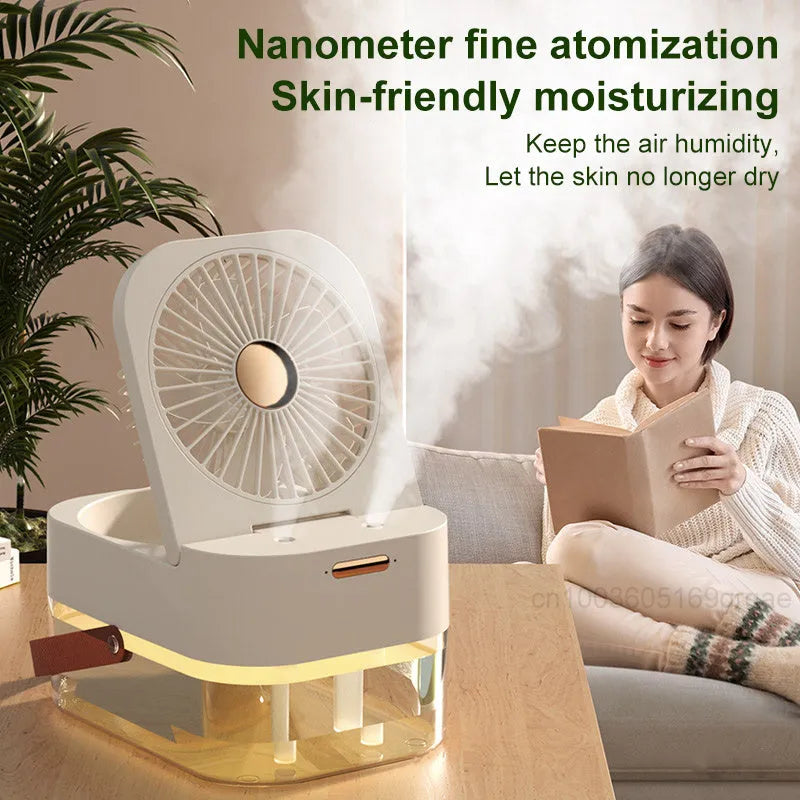 Pearl white USB desktop humidifier mist fan with water tank, remote control, and night light on a wooden desk.