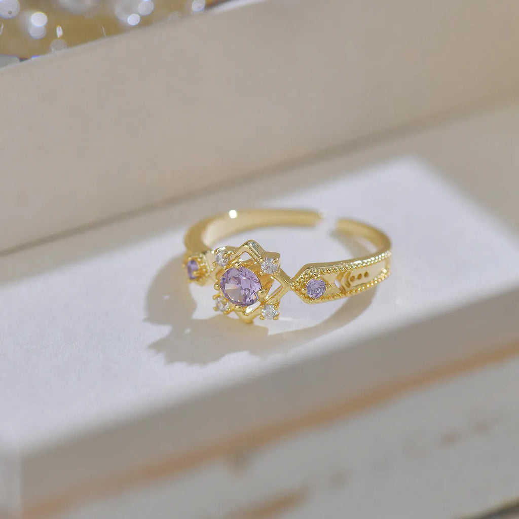 French style geometric open mouth copper ring with purple zircon stones on a model's hand.