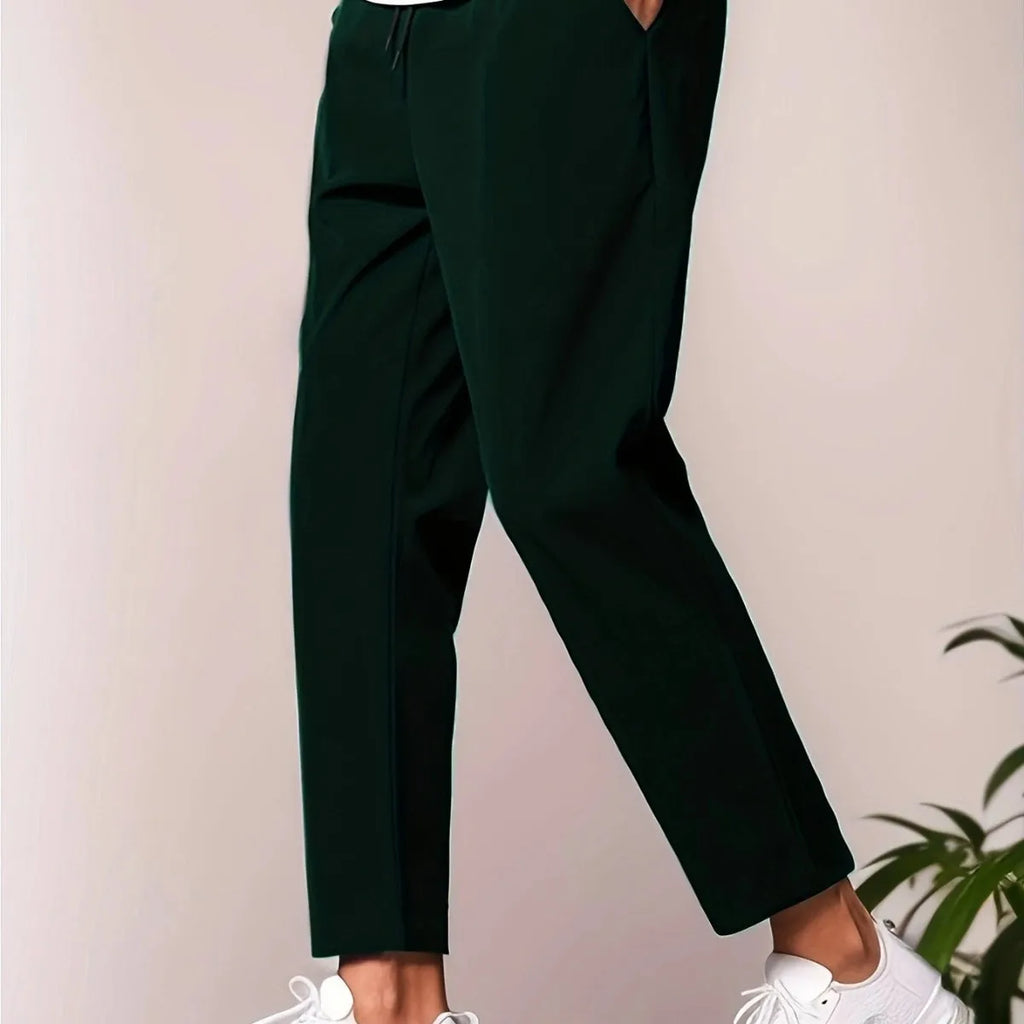 Men's slim fit ankle length trousers in black polyester, tapered leg, mid waist, cropped cut.